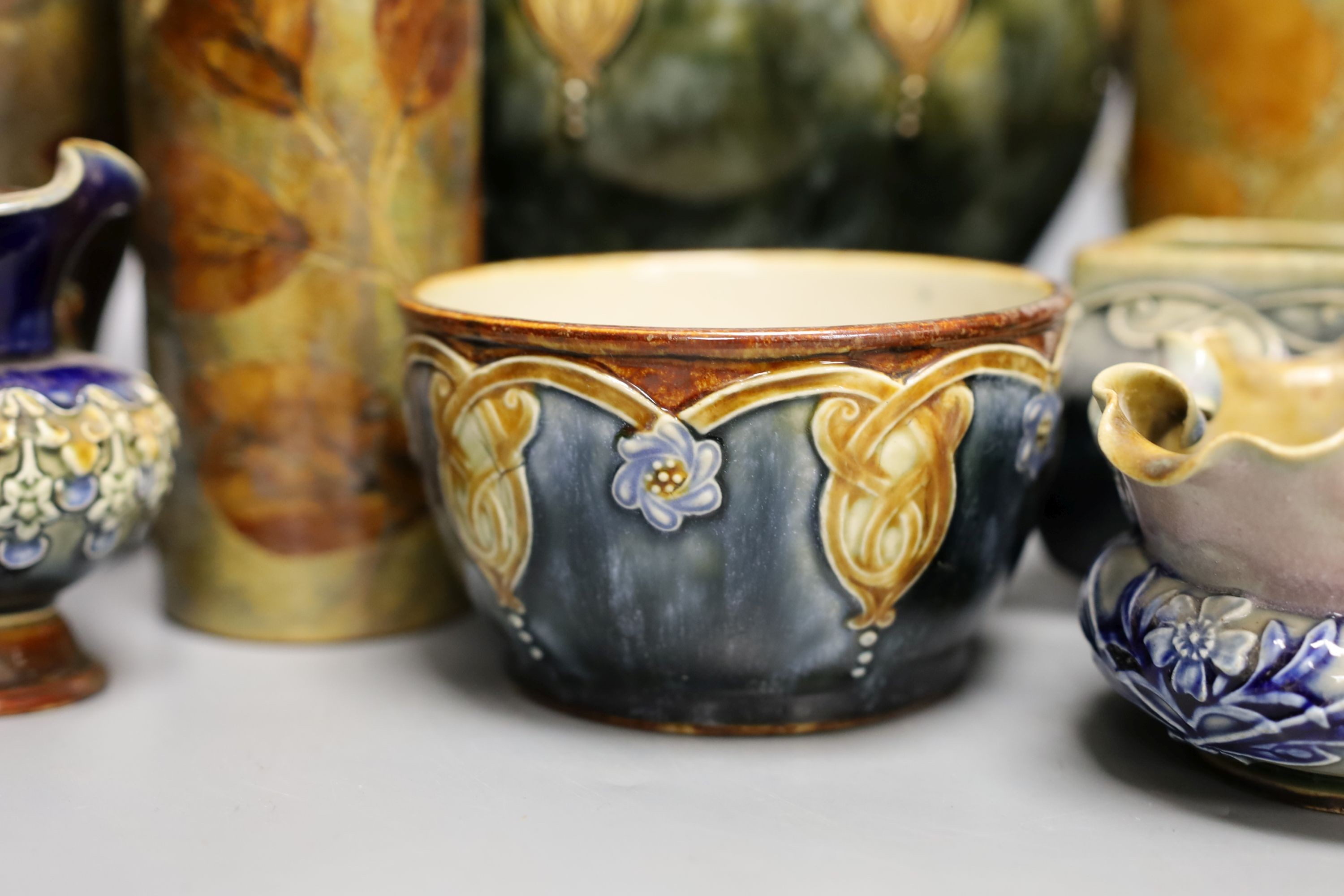10 pieces of Doulton Lambeth stoneware including a jardiniere, vases etc, largest item jardiniere, 19 cms diameter.